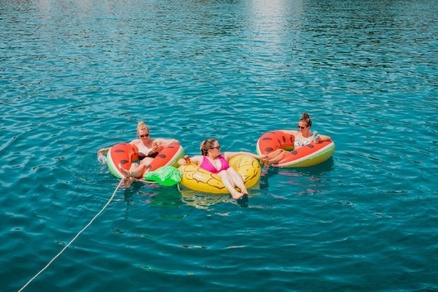 Guests on floaties on a sail week in Croatia with MedSailors.