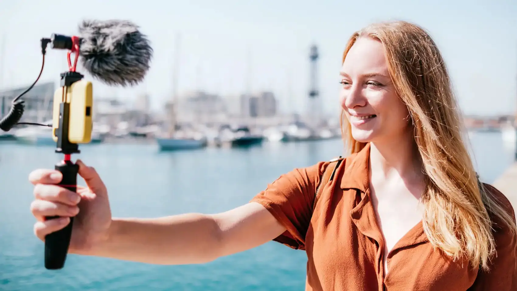 Woman filming a travel video