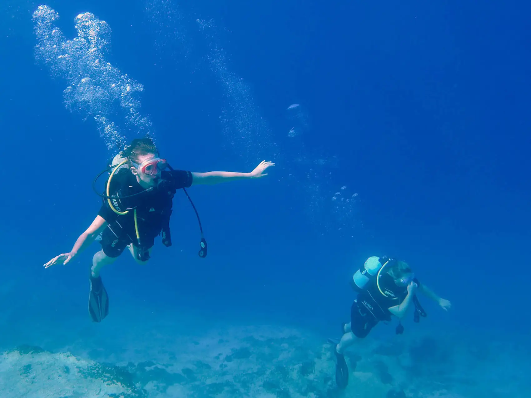 Photo of people scuba diving in Greece. Photo by Ryan Brown of Lostboymemoirs.com