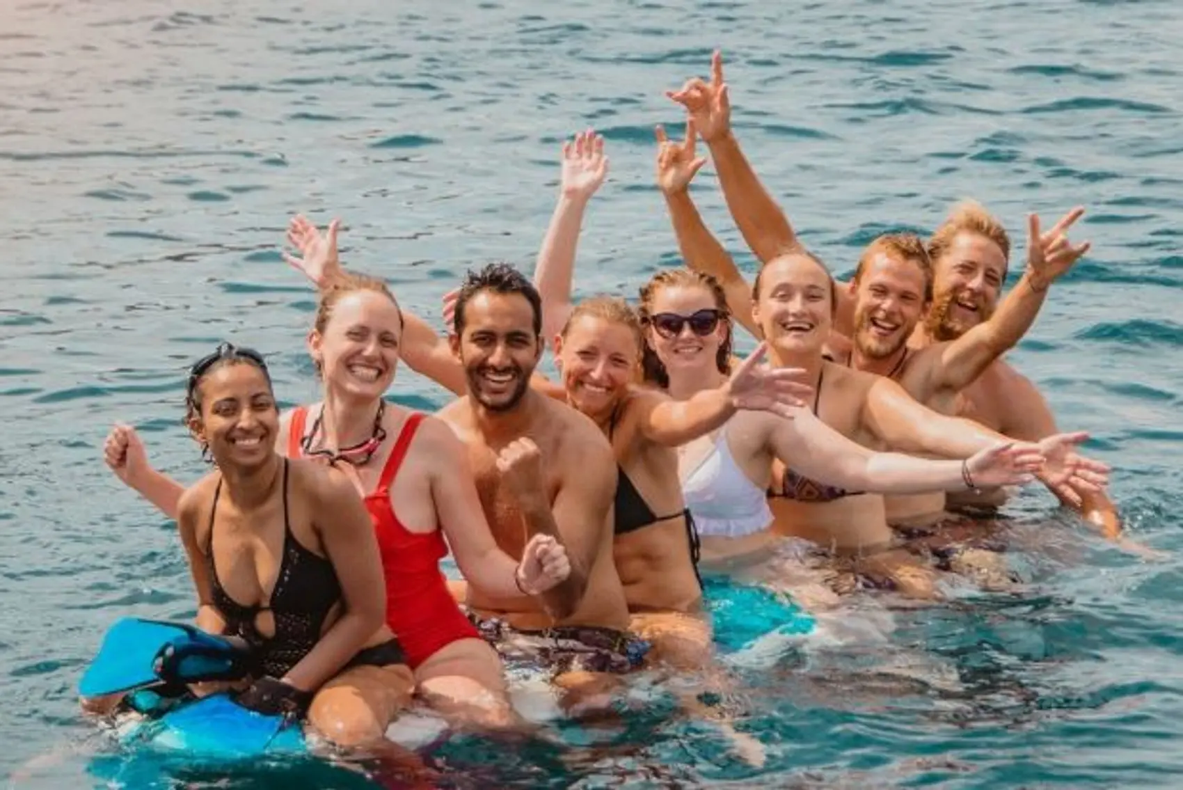 Young people having fun on a paddle board in Croatia.