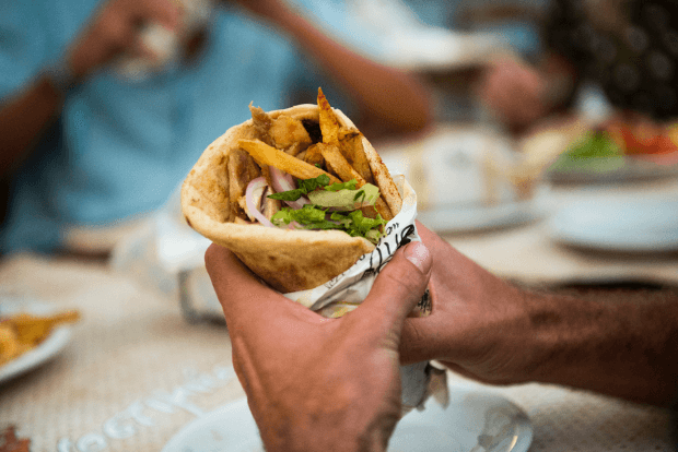 Person holding a gyros